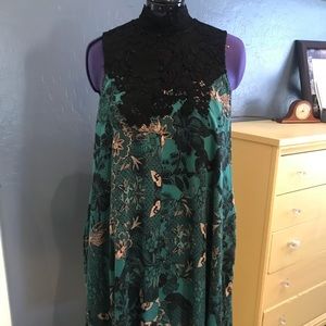 Green print sun dress with high black lace neck